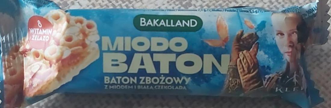 Zdjęcia - Miodo Baton Bakalland Baton zbożowy z miodem i białą czekoladą Sok dnia