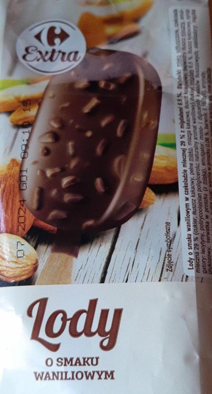 Zdjęcia - Lody o smaku waniliowym w czekoladzie mlecznej z orzechami Carrefour